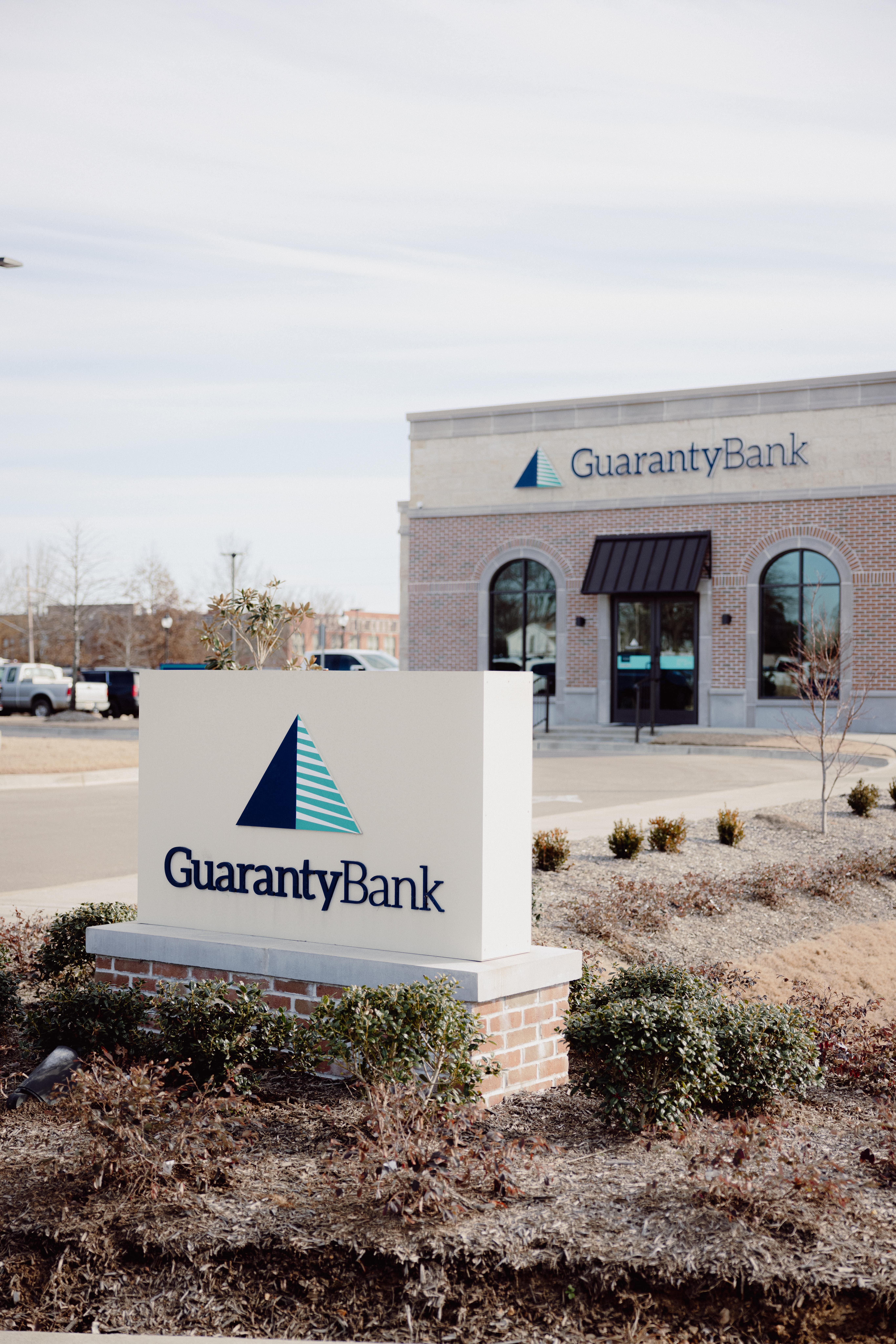Guaranty Bank signage in front of the bank building.